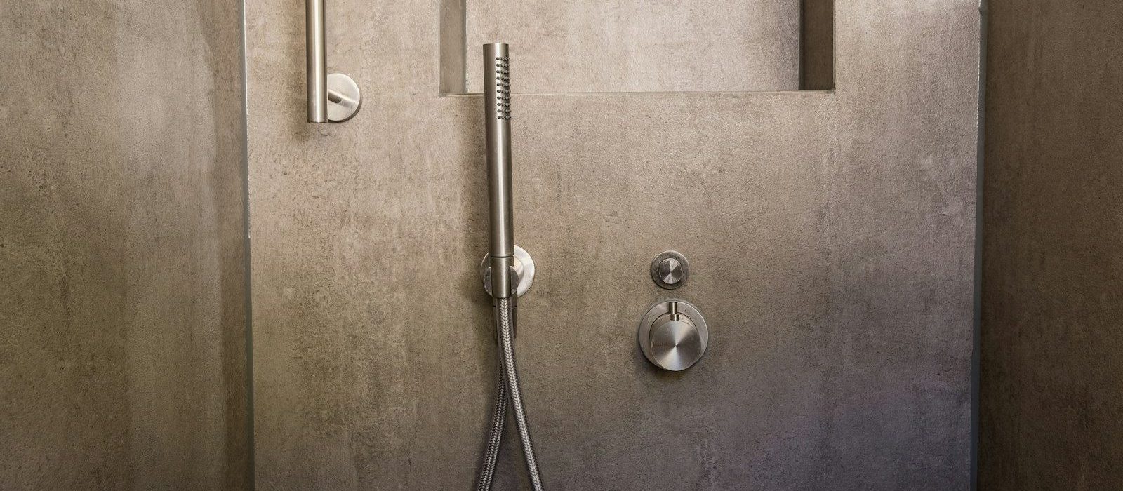 stainless steel door knob on brown wooden door